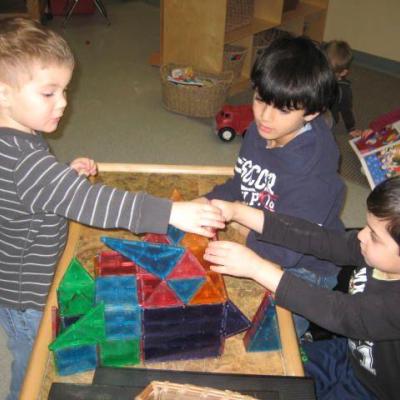 two children playing with blocks